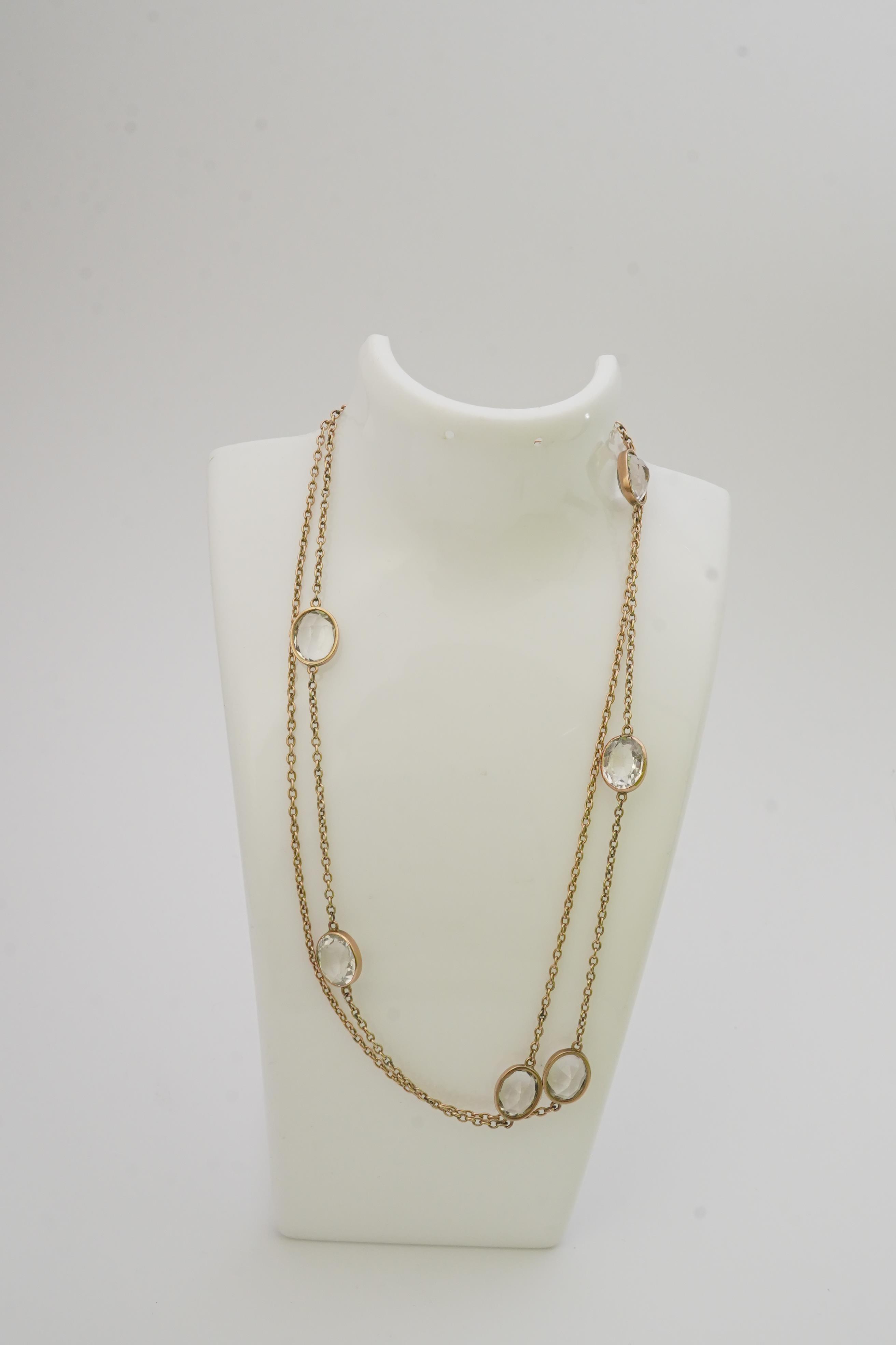 A rock crystal long chain necklace, early 20th century